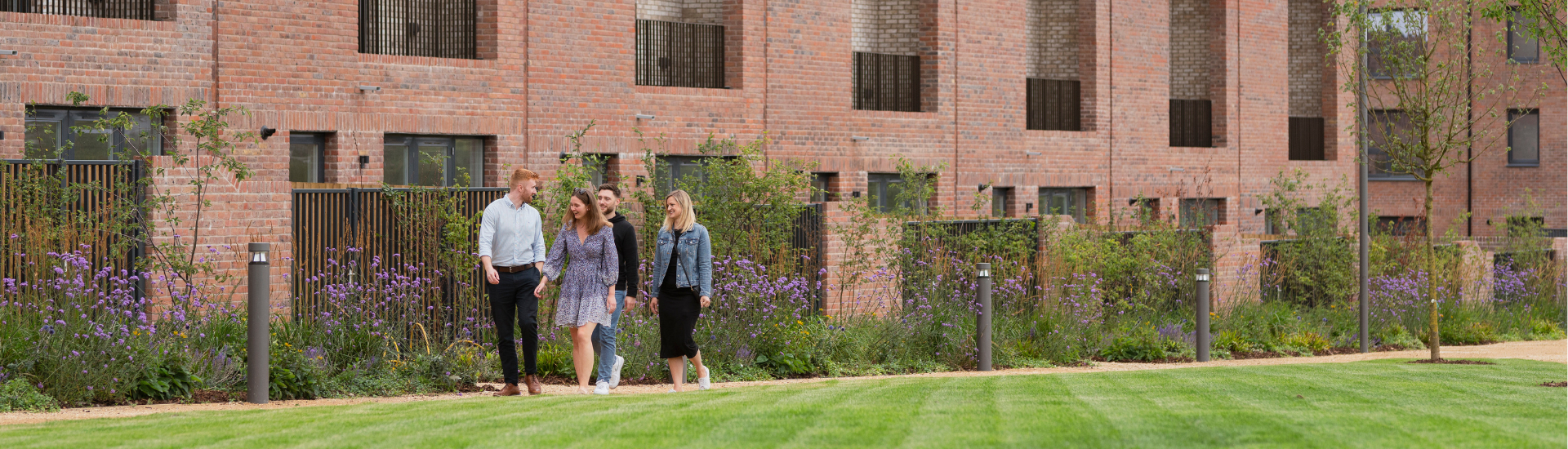 Group of young residents walking through Brabazon Park.