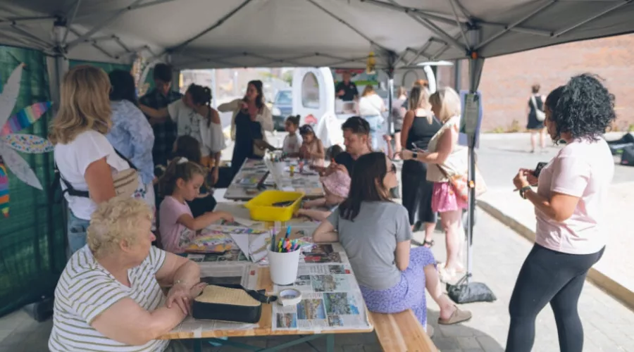 A community event at Brabazon, showcasing an arts workshop under a gazebo. 