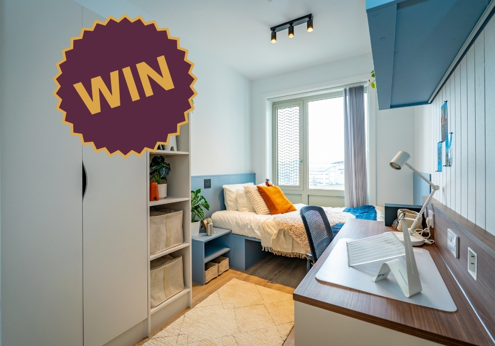 Fully furnished student accommodation bedroom at The Propeller Quarter in Brabazon, featuring a study desk, storage, comfortable bed, and natural light from a large window.