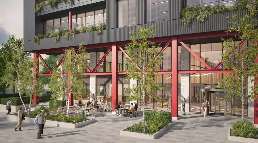 CGI of the ground floor exterior of the first office building at Brabazon, showcasing a cafe with external seating on the ground floor. 