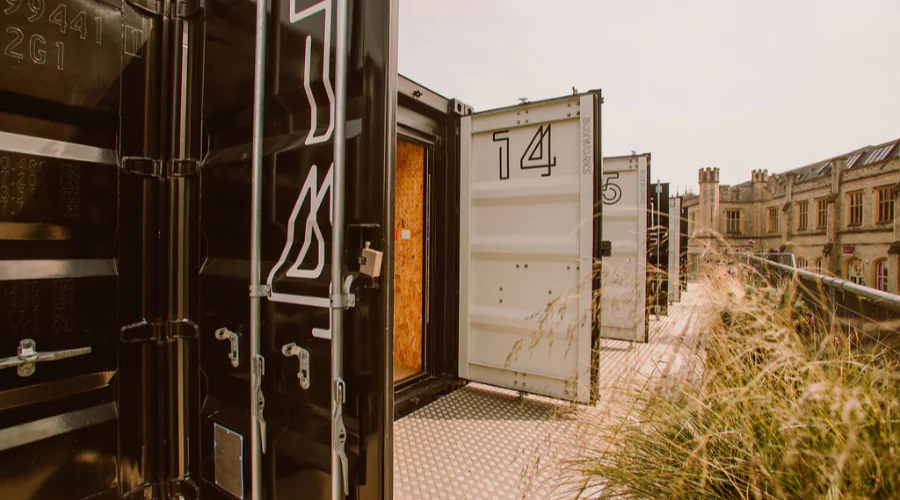 The numbered doors on Boxworks shipping container offices open at Bristol Temple Meads.