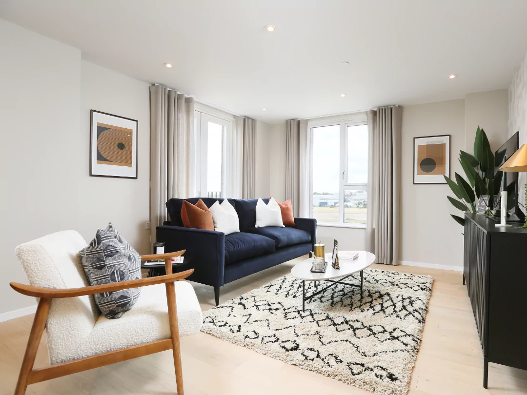 Open-plan living room flooded with natural light leading in from the terrace.