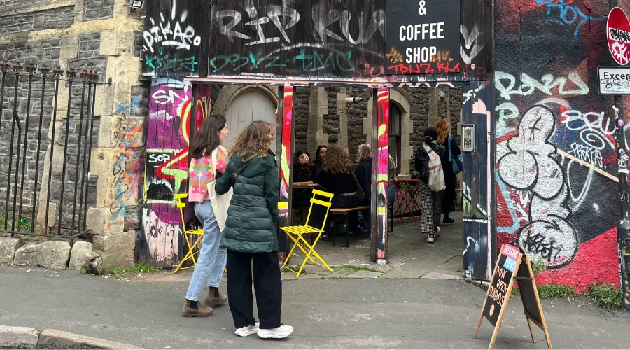 Two customers entering a coffee shop