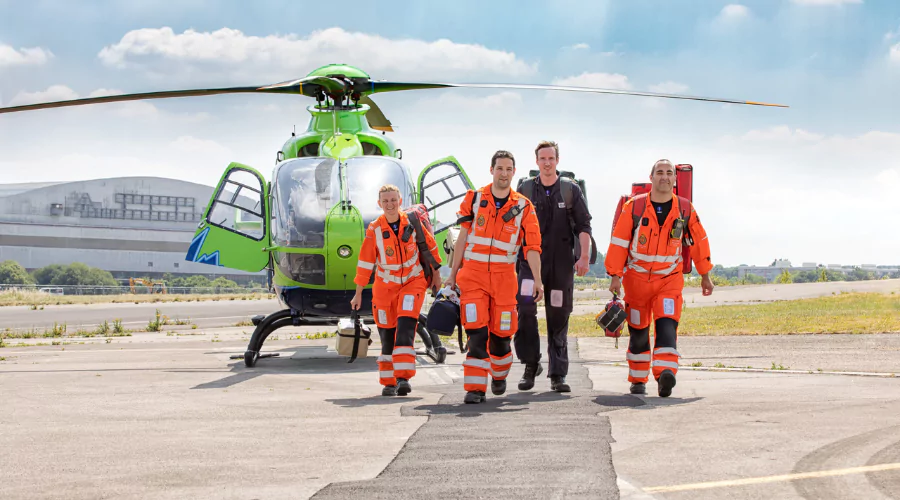 The Great Western Air Ambulance Charity crew disembarking a helicopter on sunny day at Brabazon.
